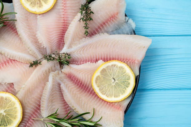 istock Raw tilapia fillet photography . Top view 2187848028