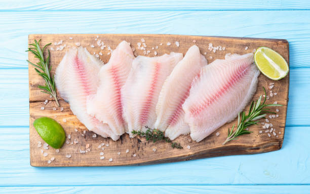 istock Raw tilapia fillet photography . Top view 2187848031