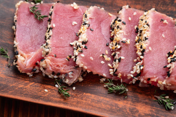 istock Sliced tuna steak with sesame photography . Top view 2187848121