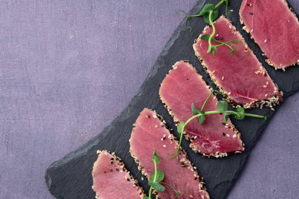istock Sliced tuna steak with sesame photography . Top view 2187848127