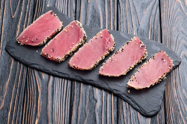 istock Sliced tuna steak with sesame photography . Top view 2187848130