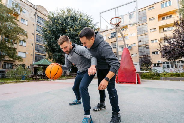 istock Two Young Men Playing Basketball 2187854457