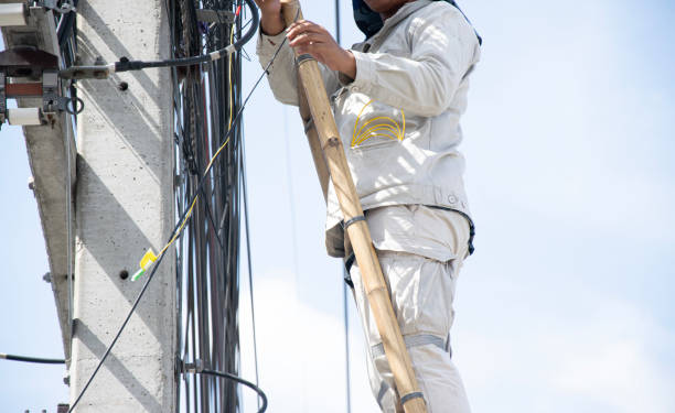 istock The technician is repairing the cables on the electric pole. 2187857181