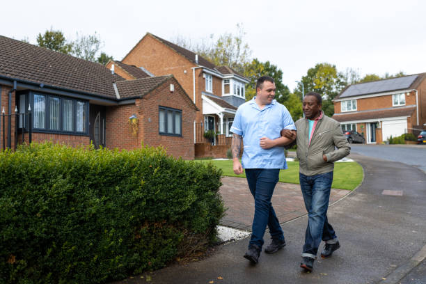 istock Community Nurse and Patient Enjoying Fresh Air on a Walk 2187858337