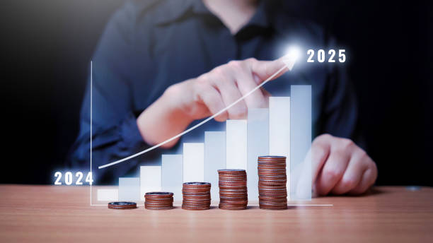 istock Woman uses hand touch to change data from 2024 to 2025 2187859408