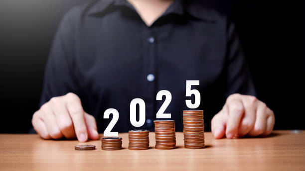istock Woman uses hand touch to change data from 2024 to 2025 2187859417