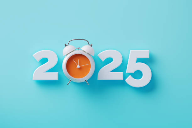 istock Orange Colored Alarm Clock And  2025 On Blue Background 2187860203