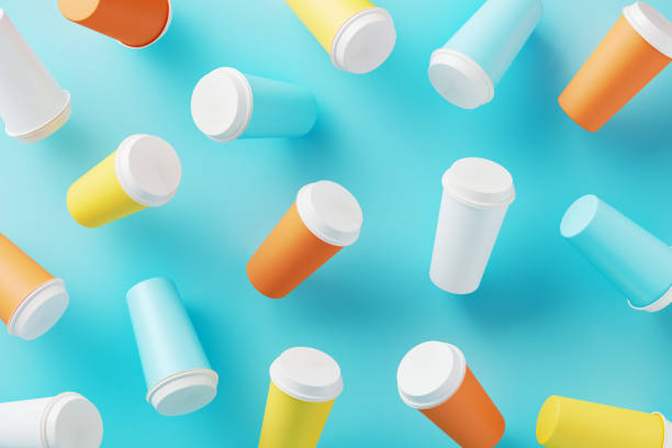 Colorful mockup insulated drink cups on blue background. Horizontal composition with copy space.