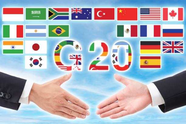 istock G20 Summit Flags and Handshake Symbolizing Global Economic Cooperation and Diplomacy 2187860723