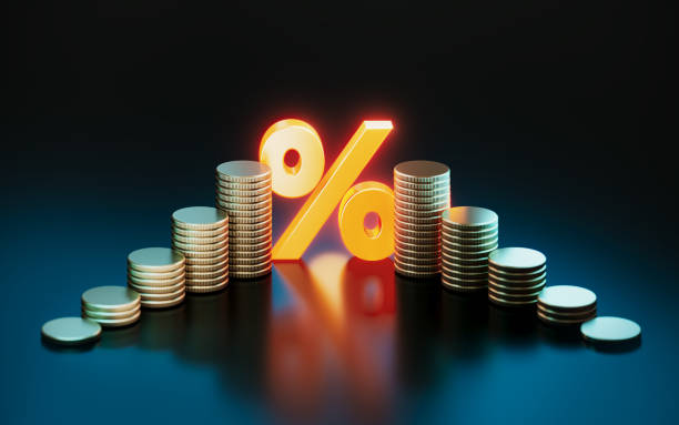 istock Glowing Orange Percentage Sign And Coins On Blue Background 2187860774
