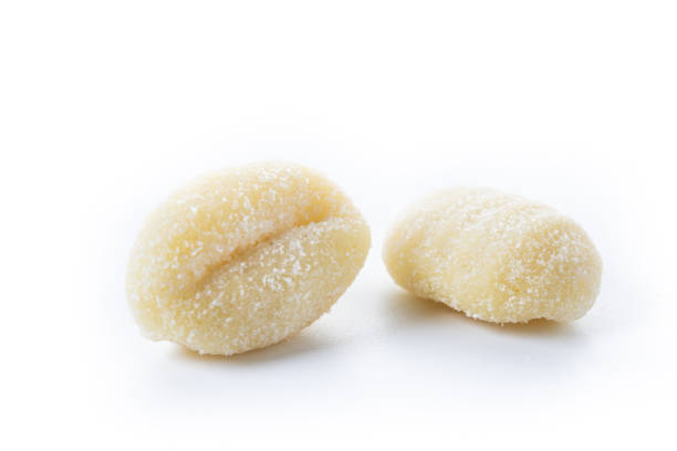istock Tasty raw gnocchi isolated on white background 2187861469