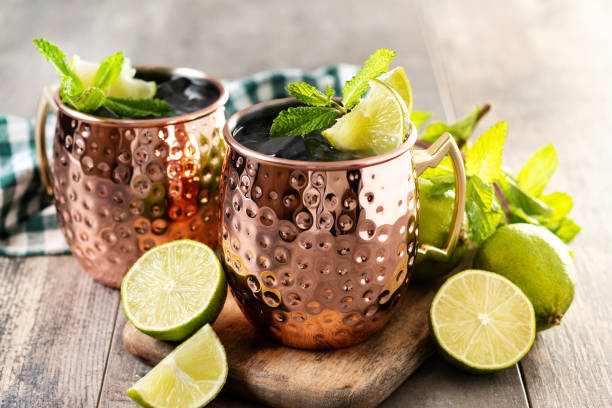 istock Apple Cider Moscow Mule cocktail on wooden table 2187863595