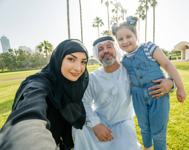 istock little kid take a selfie with the arab family 2187868236