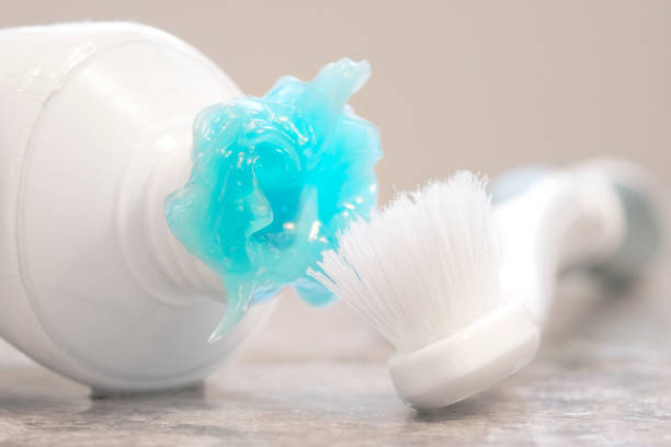 istock Worn Toothbrush and Messy Toothpaste Blue Gel for Brushing Teeth 2187869359