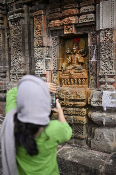 istock Woman visitor capturing intricate carvings 2187871087