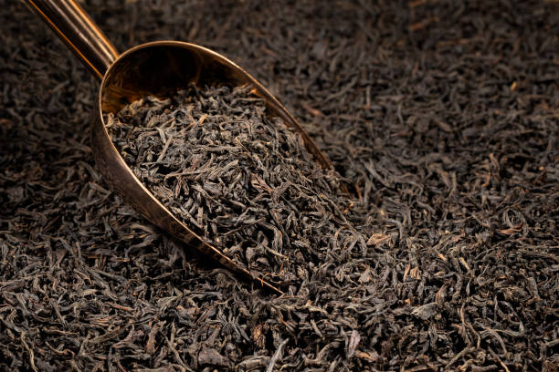 istock Dried tea leaves on scoop.  Black tea. 2187872564