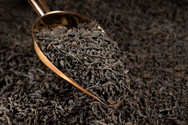 istock Dried tea leaves on scoop.  Black tea. 2187872576
