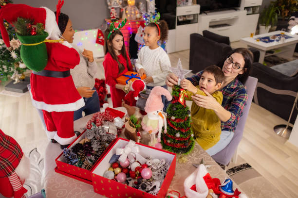 istock Neurodivergent boy having so much fun decorating the Christmas tree 2187873997
