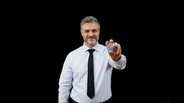 An Hispanic man holding a \