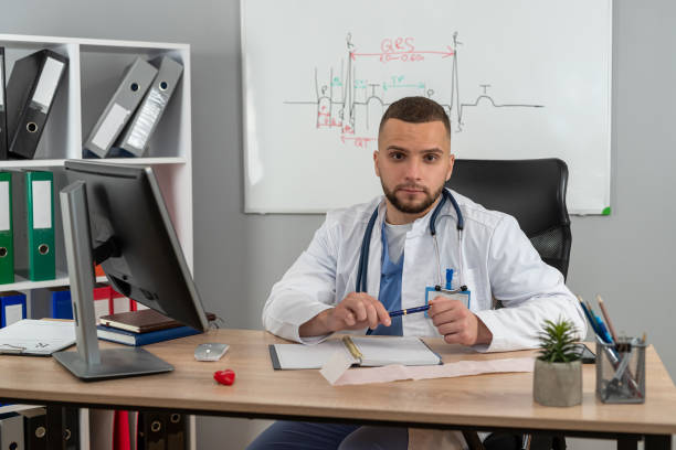 istock Young doctor or e general practitioner physician work in patient files at office medical clinic 2187874293