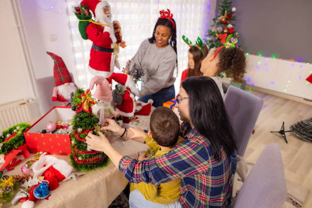 istock Happy neurodivergent boy decorating his own Christmas tree 2187874299