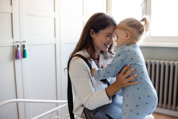 istock Mother and child sharing a tender moment indoors during morning before work 2187874334