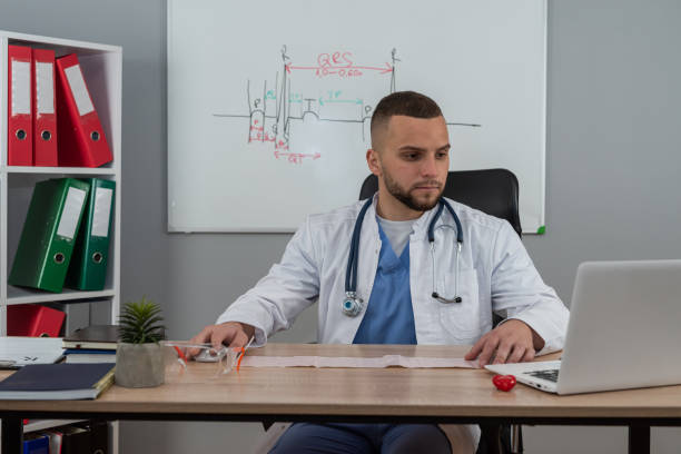 istock Young doctor or e general practitioner physician work in patient files at office medical clinic 2187875575