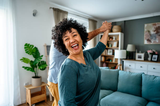 istock Joyful mature couple having fun at home 2187876052