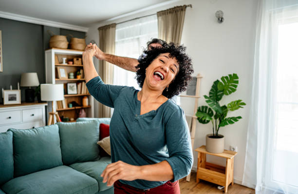 istock Joyful mature couple having fun at home 2187876480