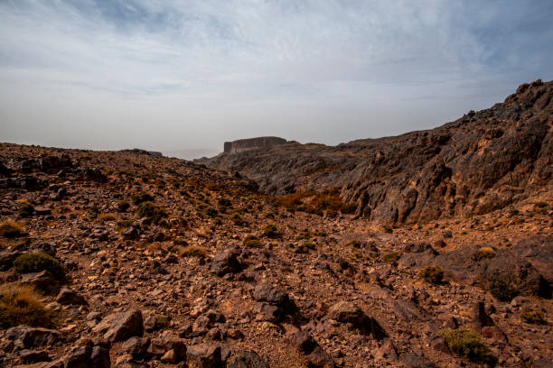 panorama of the Moroccan Atlas mountain peaks with desert valleys and orange rocks among the Berber trails in Jebel Saghro near Ouarzazate Marrakech in Morocco