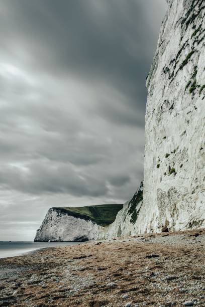istock White chalk cliffs at a beach under a dramatic cloudy sky in England 2187876735