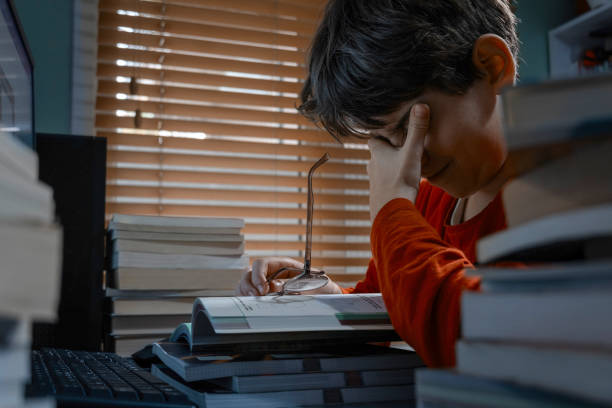 istock Tired student struggling with studies at home 2187877557