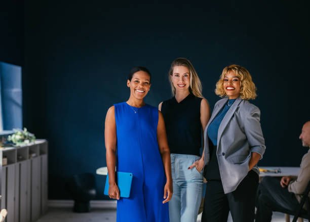 istock Confident Businesswomen Posing Together in Modern Office Setting 2187877886