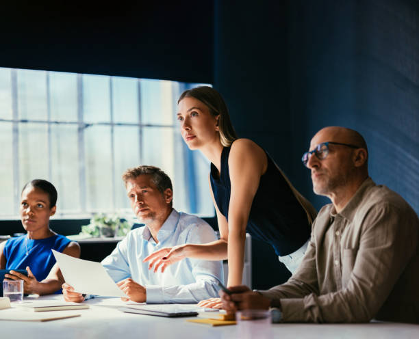 Focused Business Meeting with Diverse Team in Modern Office