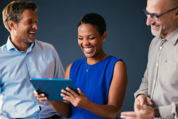 Successful Team Collaboration with Digital Tablet in Office