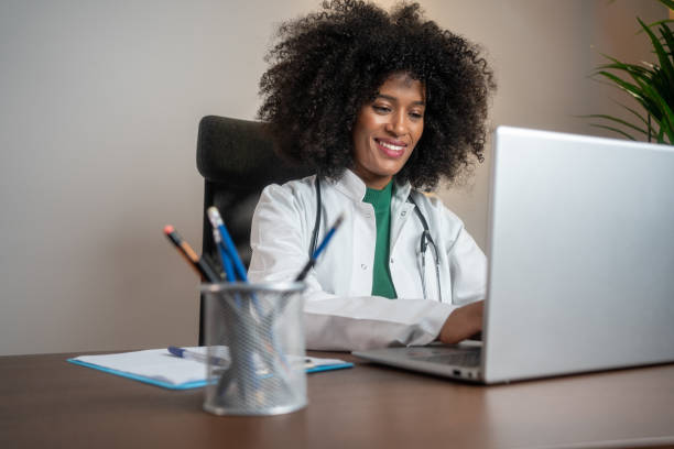 istock Happy medical expert reading an e-mail on a computer in the office at hospital. 2187879415