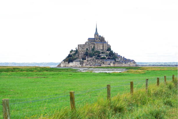 Le Mont Saint-Michel monastery in Normandy by sunset, France