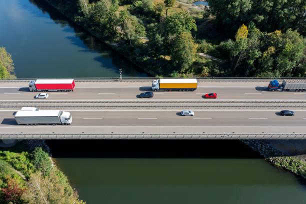 istock Traffic on highway over canal, aerial view 2187884716