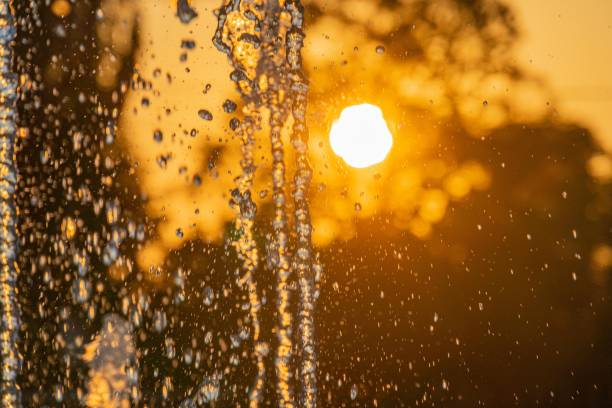 istock A captivating image of a sunset waterfall, with golden droplets cascading against the backdrop of cool surroundings The perspective enhances the grandeur and intimacy of the scene 2187884978