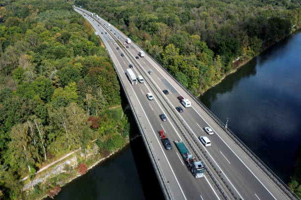istock Traffic on highway over canal, aerial view 2187885118