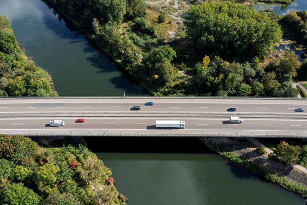 istock Traffic on highway over canal, aerial view 2187885380
