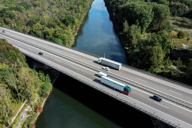istock Traffic on highway over canal, aerial view 2187885599