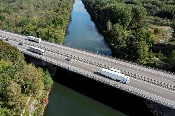 istock Traffic on highway over canal, aerial view 2187885803