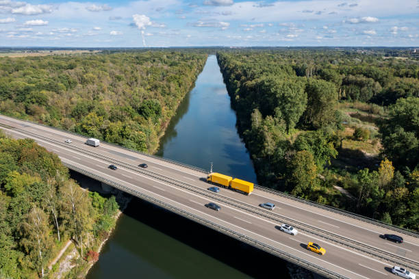 istock Traffic on highway over canal, aerial view 2187886167