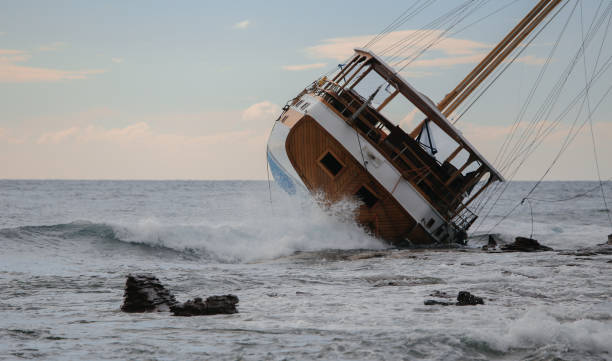 Rusty old ship lying at the rocky seashore