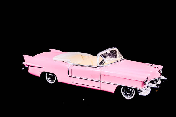 Pink Caddilac Car Toy Model Isolated on a Black Background