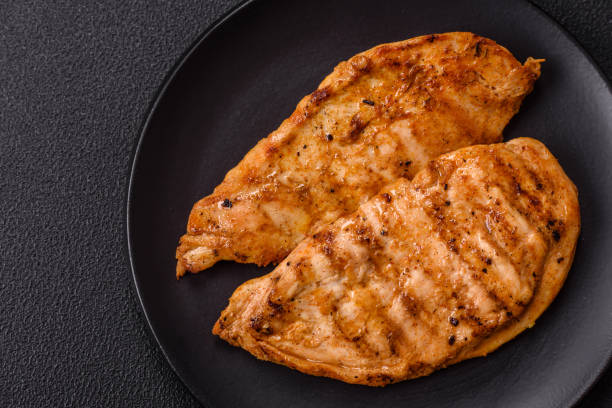 istock Grilled chicken fillet with salt, spices and herbs 2187900344