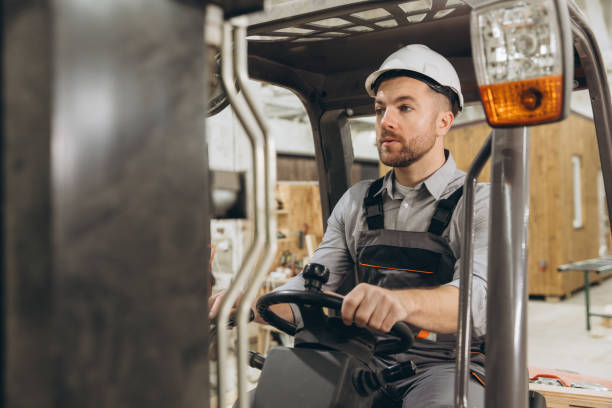 istock Warehouse worker driving forklift in modular building factory 2187901200