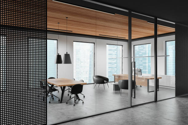 istock Stylish office interior with meeting table and chairs, ceo workplace near window 2187902061