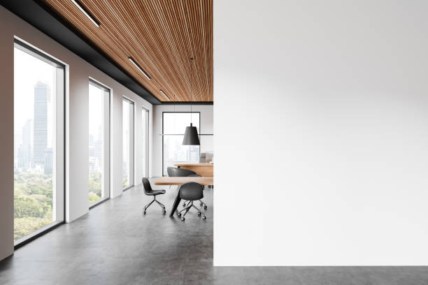 istock Office interior with meeting table and chairs, ceo desk near window. Mockup wall 2187902175